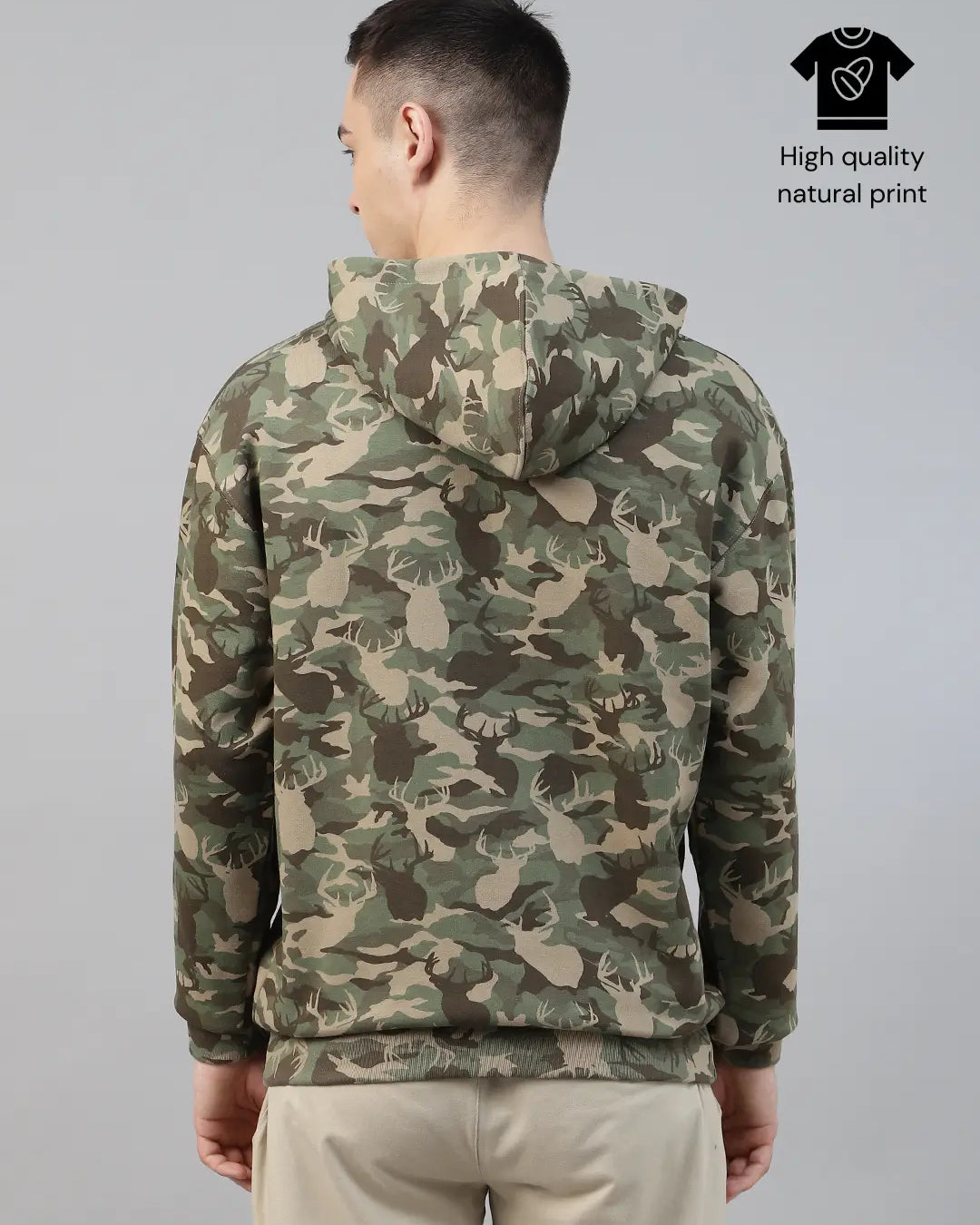 Person wearing a camouflage army print hoodie