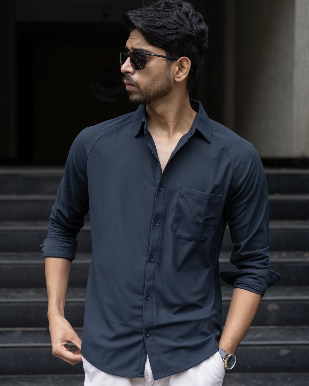 Man wearing a black blue solid shirt