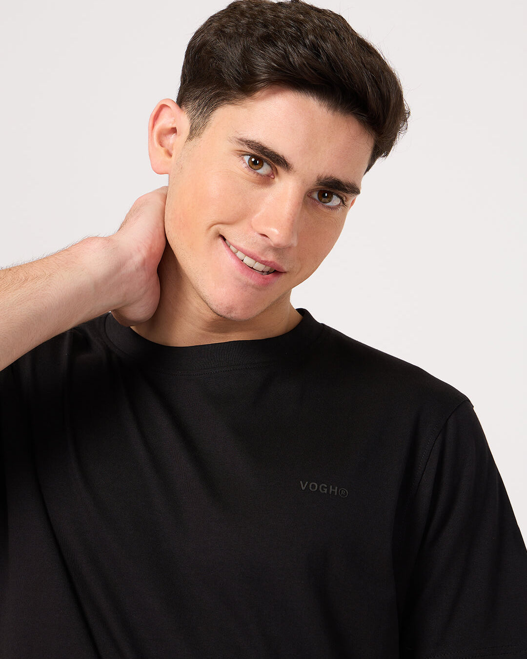 man wearing a plain black tee