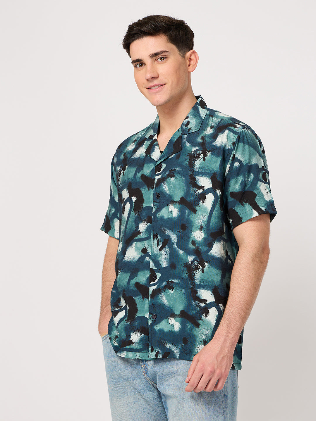 A man wearing a vogh's rayon resort shirt