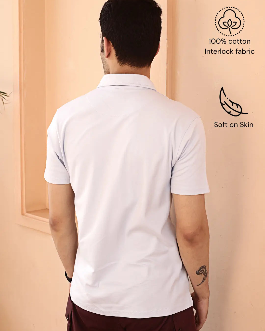 Man wearing a white polo t shirt