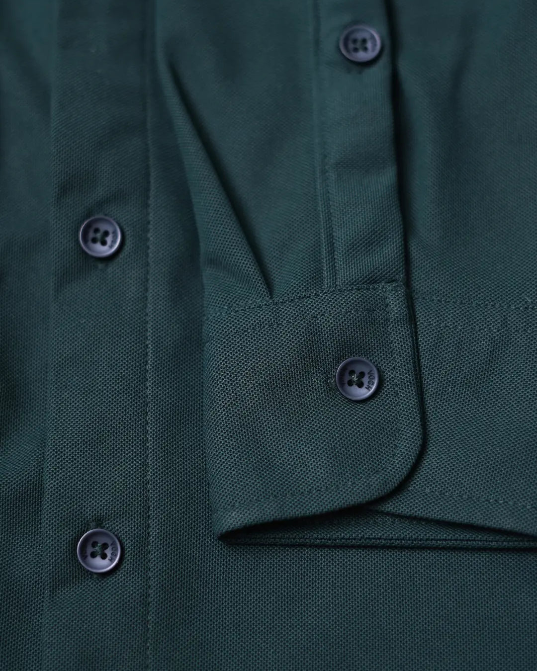 dark green shirt sleeve close up
