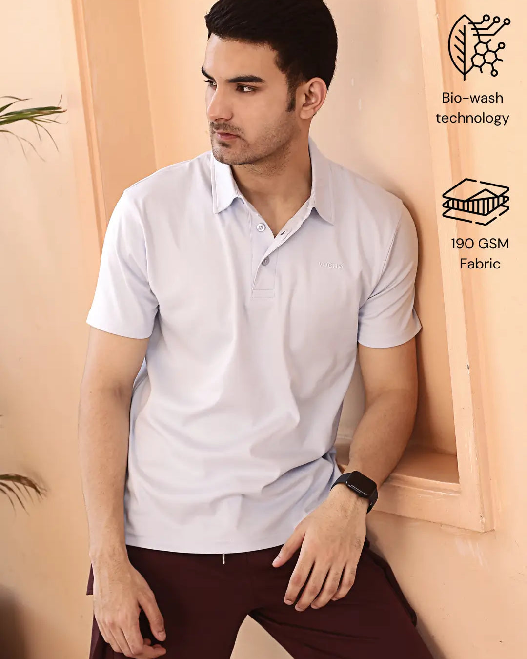 Man wearing a light sky blue polo shirt