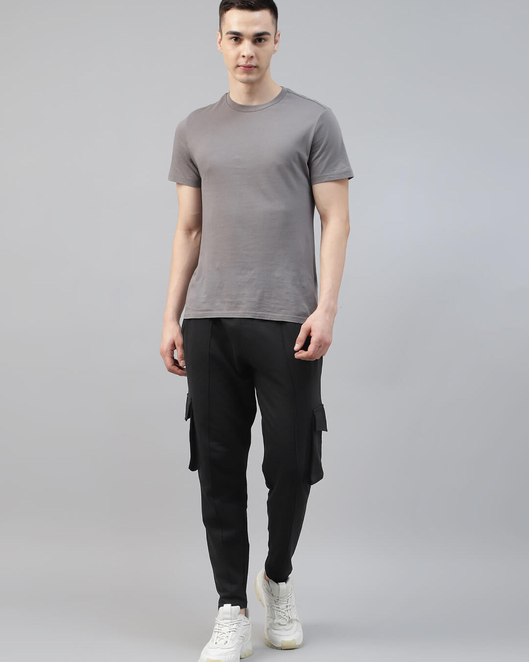 man in grey t shirt with black cotton cargo jogger pant