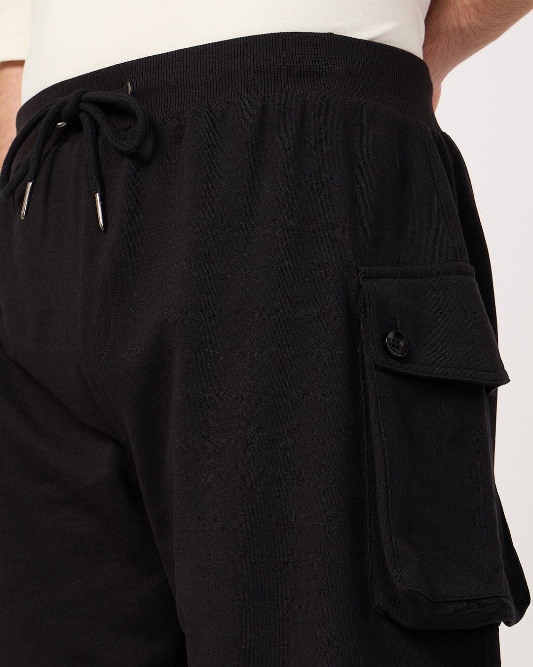 Black cotton cargo shorts with pocket on a white background