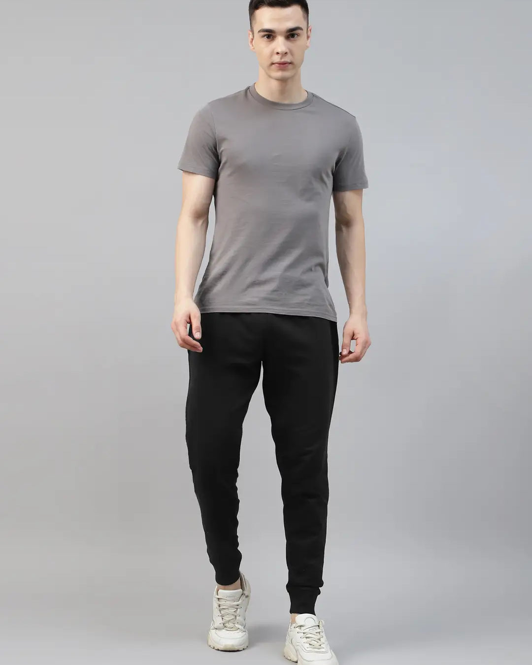 Man wearing a gray t-shirt and black cotton jogger pant