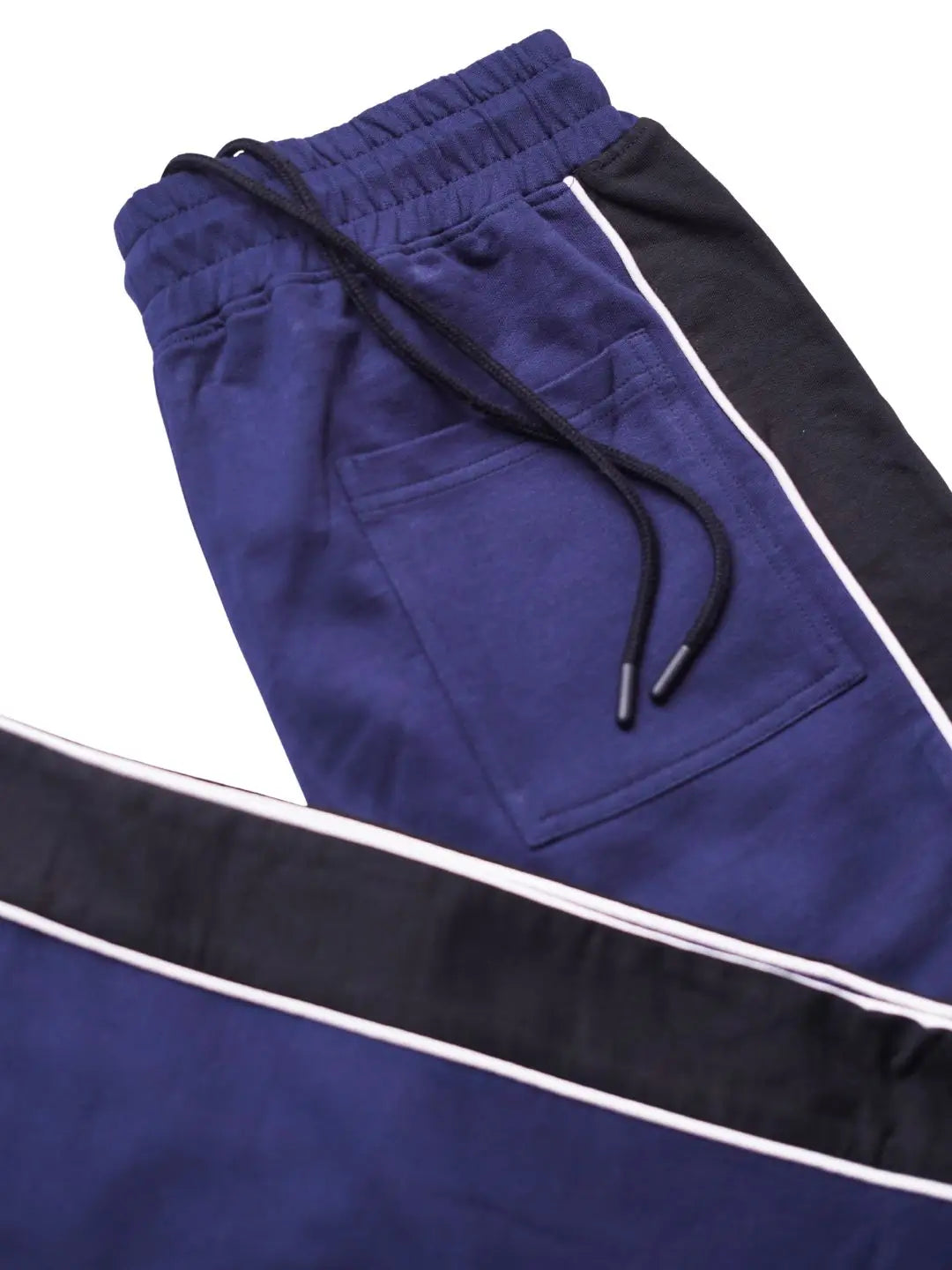 Navy blue and black track pants with white side stripes