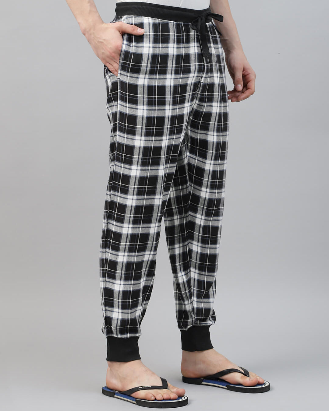 Person wearing black and white check jogger pant