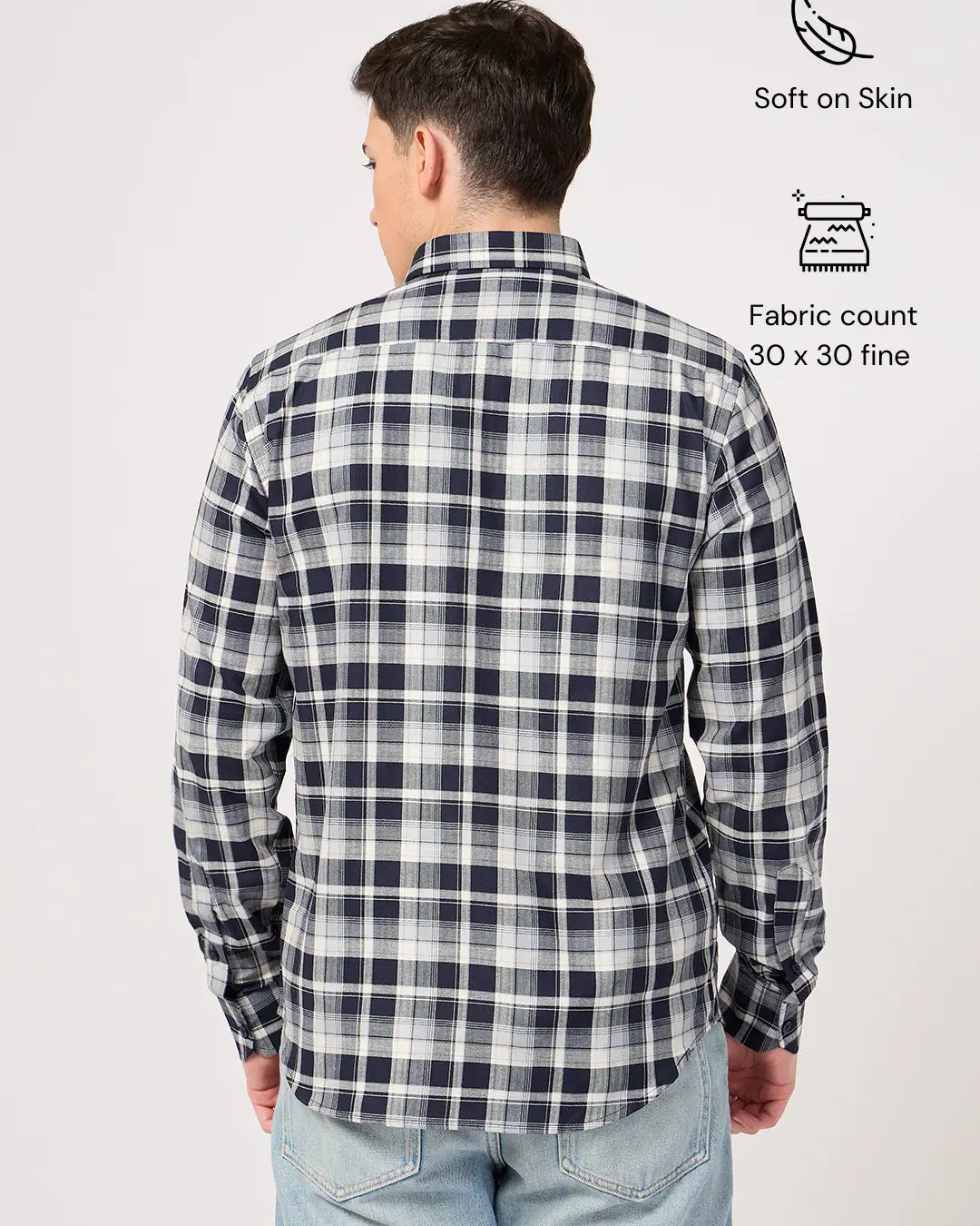 Person wearing a navy and white check shirt with text indicating features