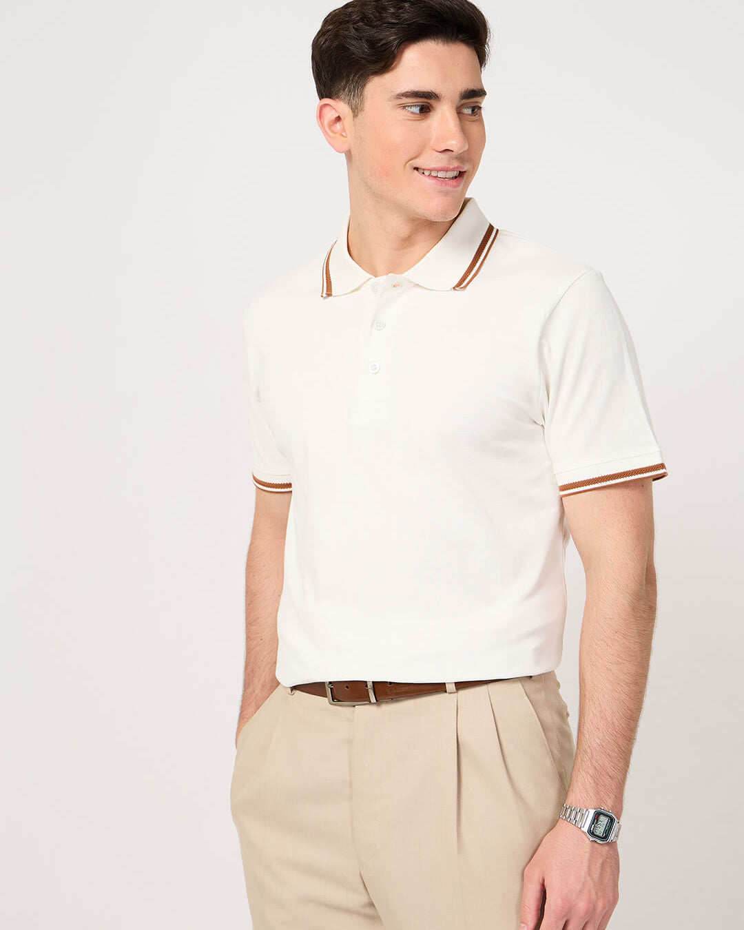 man wearing a classic white polo t-shirt with jacquard collar and trouser