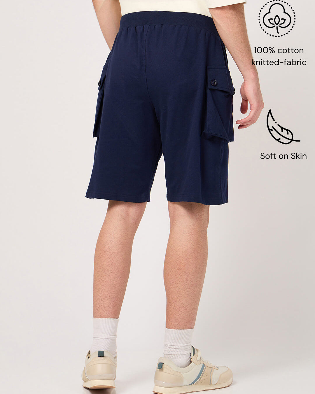 Person wearing navy cargo shorts made with pure cotton