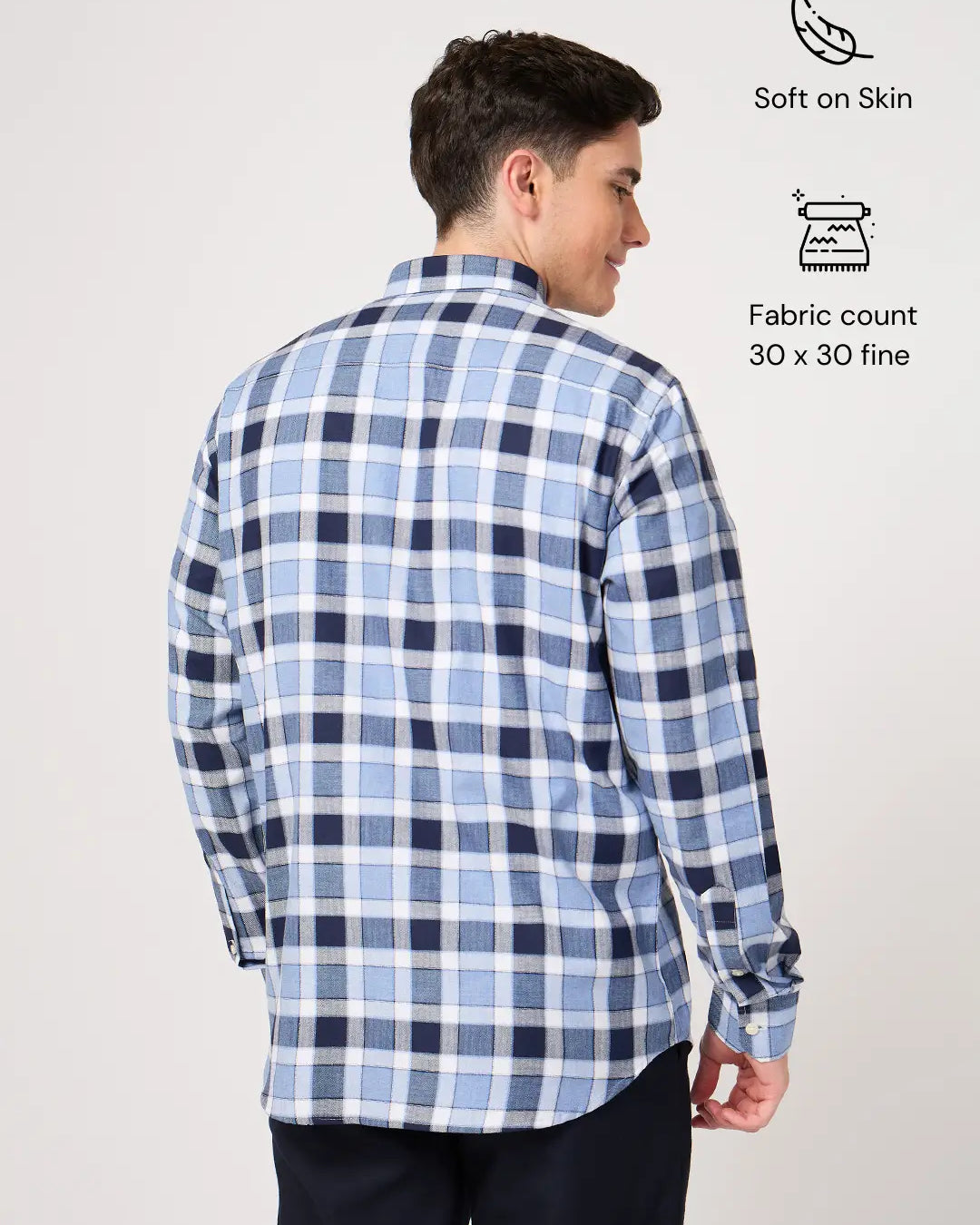 Man wearing a blue and white checkered shirt