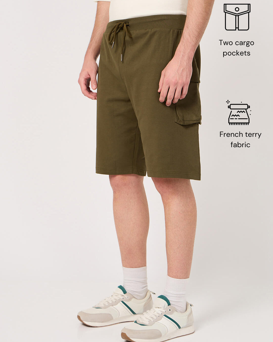 Person wearing olive green shorts with cargo pockets
