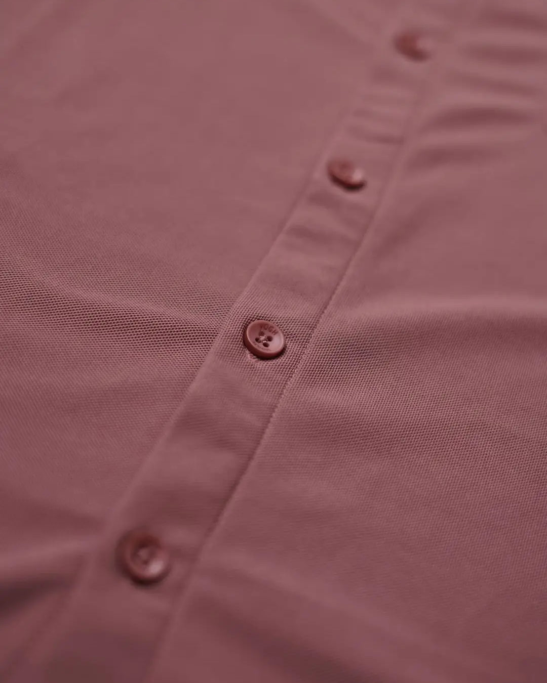 Close-up of a solid shirt with buttons