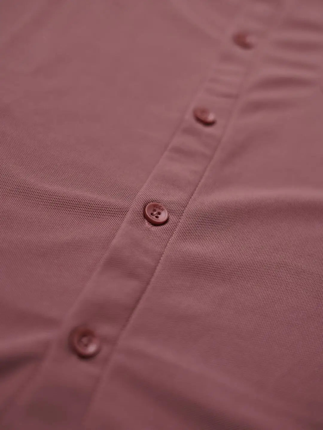 Close-up of a solid shirt with buttons