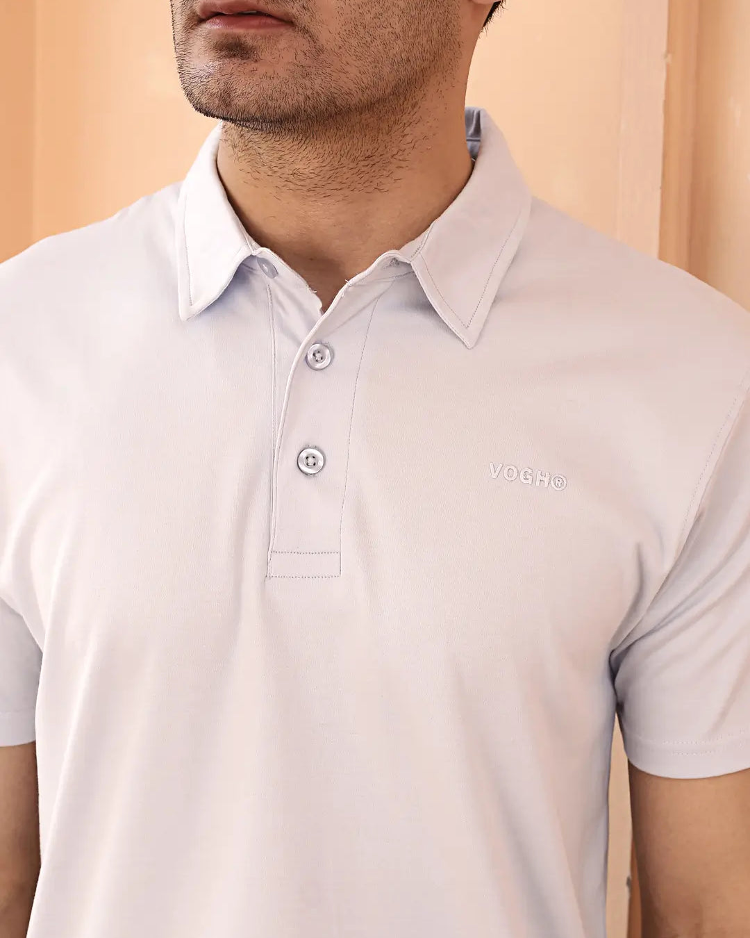Man wearing a light sky blue polo t shirt