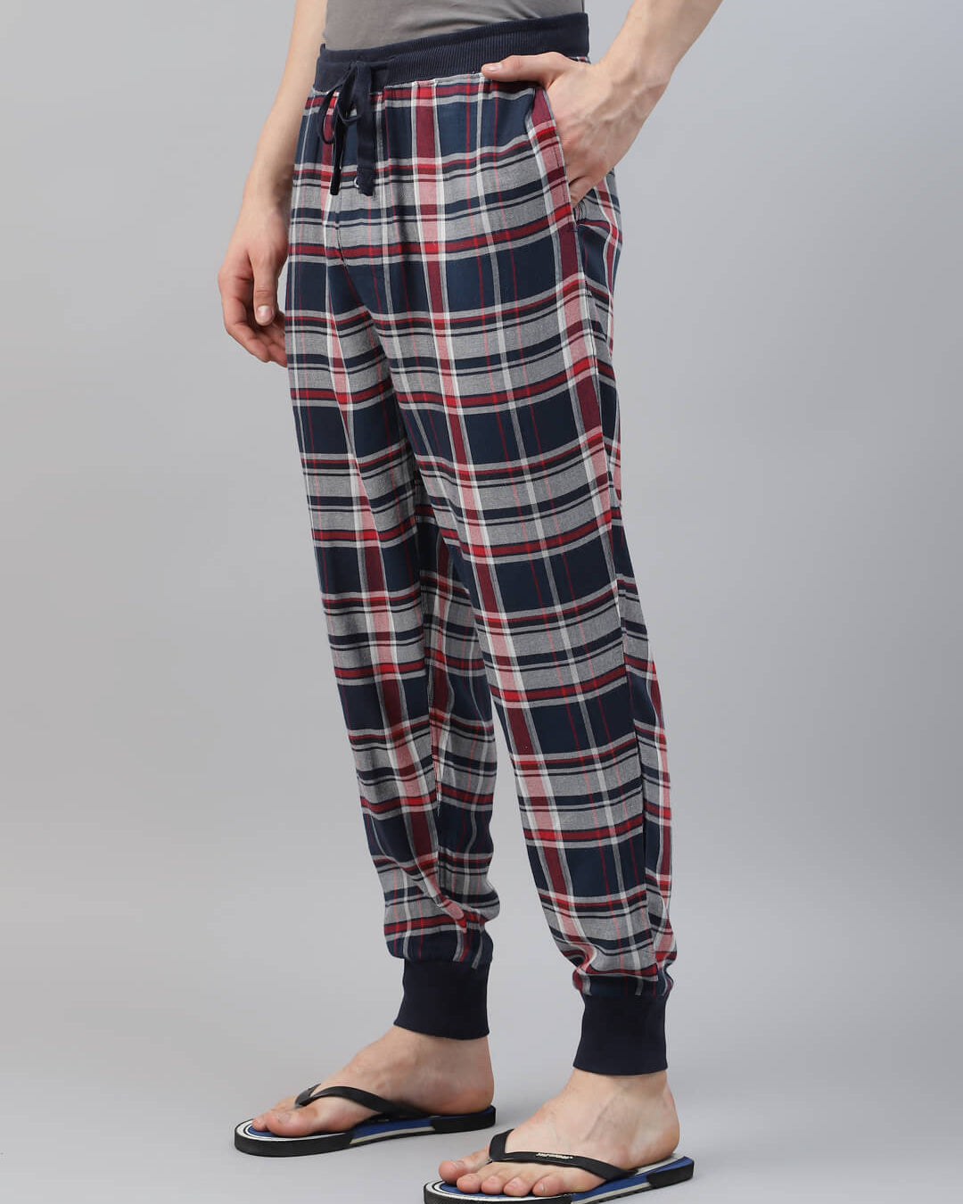Person wearing plaid pajama pant