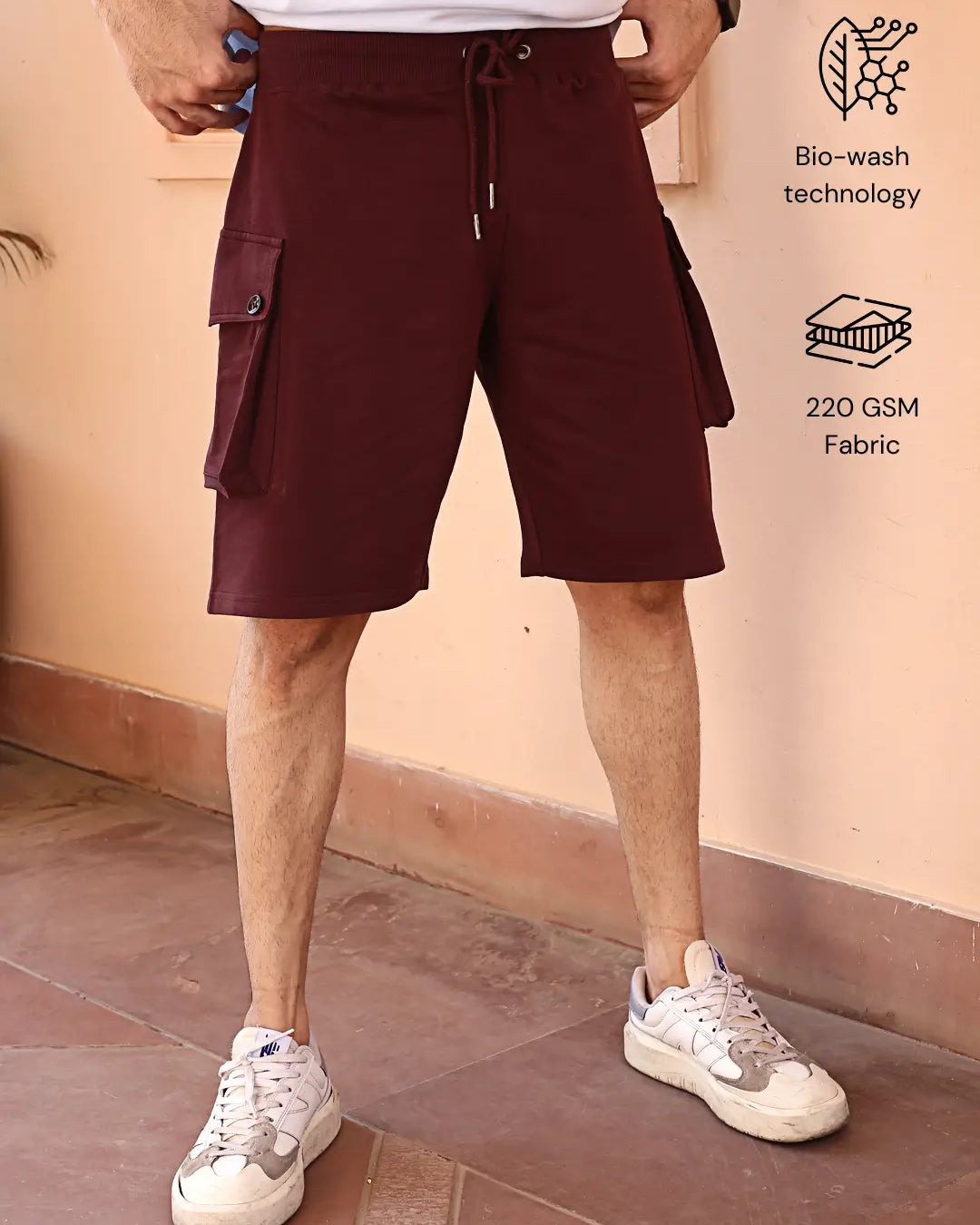 Person wearing maroon cotton cargo shorts