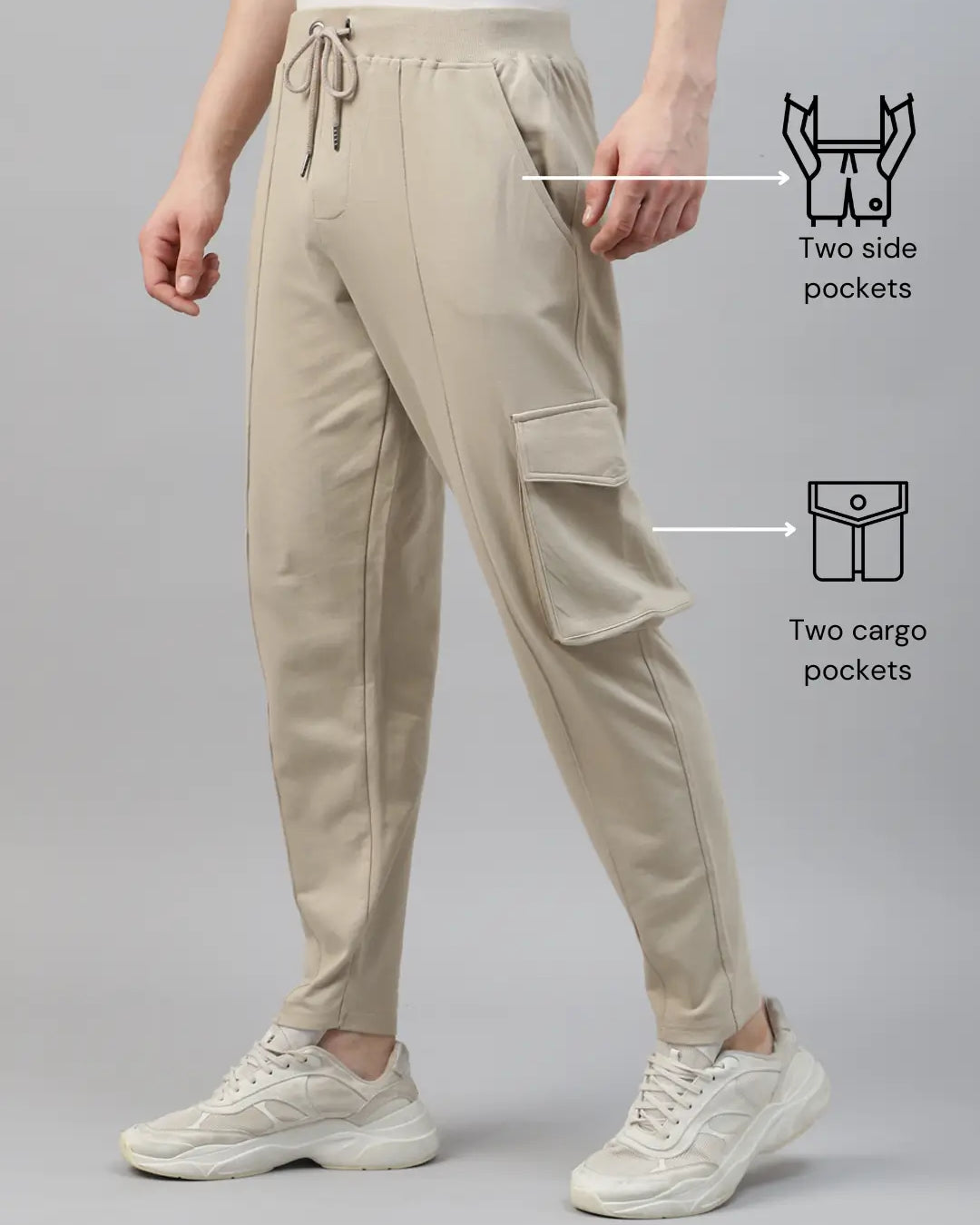 Beige cargo pants with side and cargo pockets on a gray background