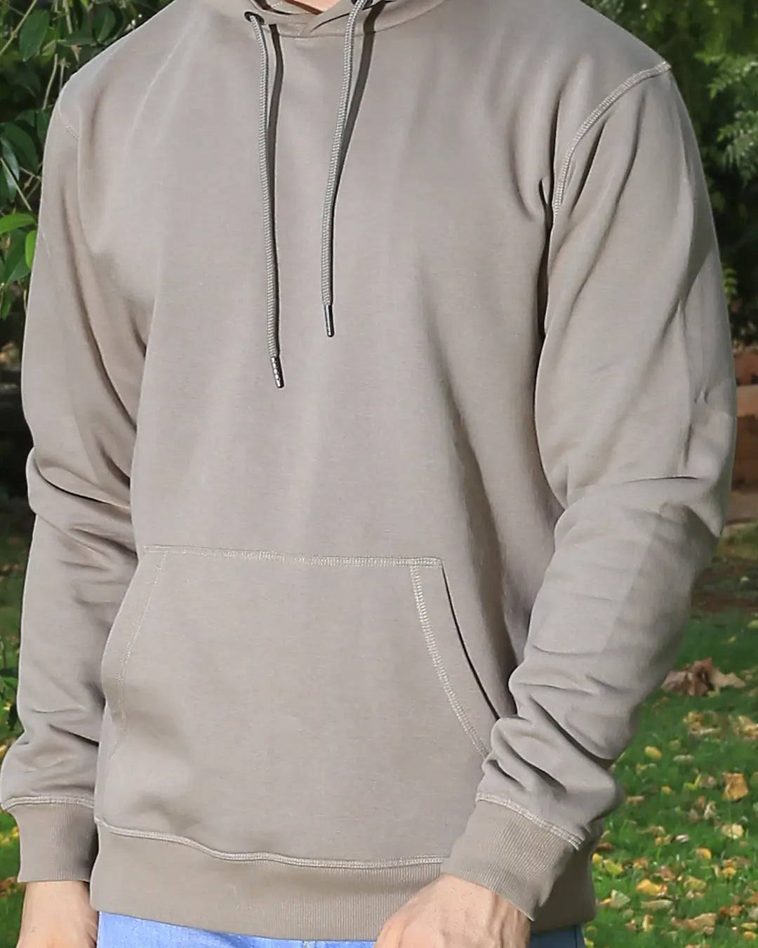 Person wearing a light gray hoodie