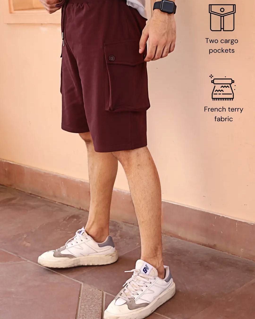 Person wearing maroon cargo shorts
