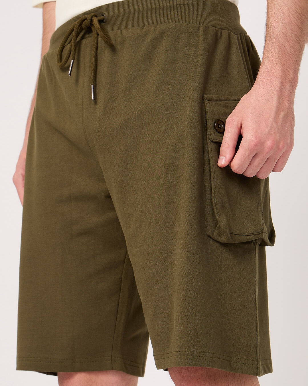 Olive green cargo shorts with a pocket on a white background