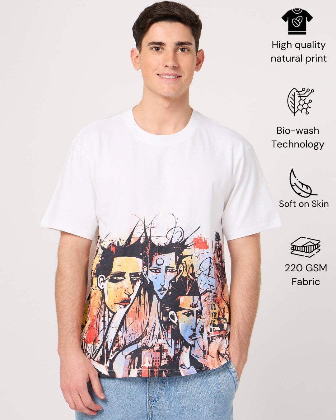 Person wearing a white t-shirt with a colorful printed graphic design