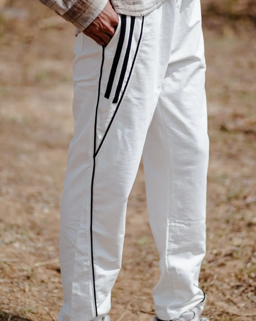 White jogger pants with black stripes
