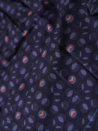 dark blue fabric with small patterns