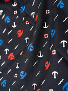 black fabric with red, white, and blue nautical pattern