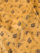 Patterned fabric with surfboard, palm tree