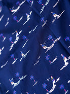 Navy blue boxer with white palm tree and sailboat