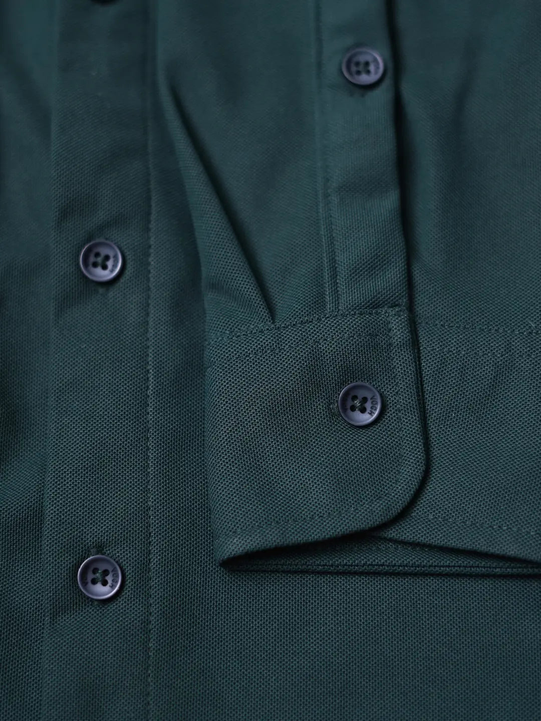 dark green shirt sleeve close up