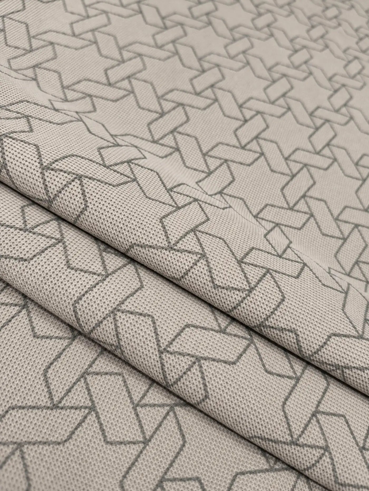 grey geometric print polo t-shirt fabric closeup