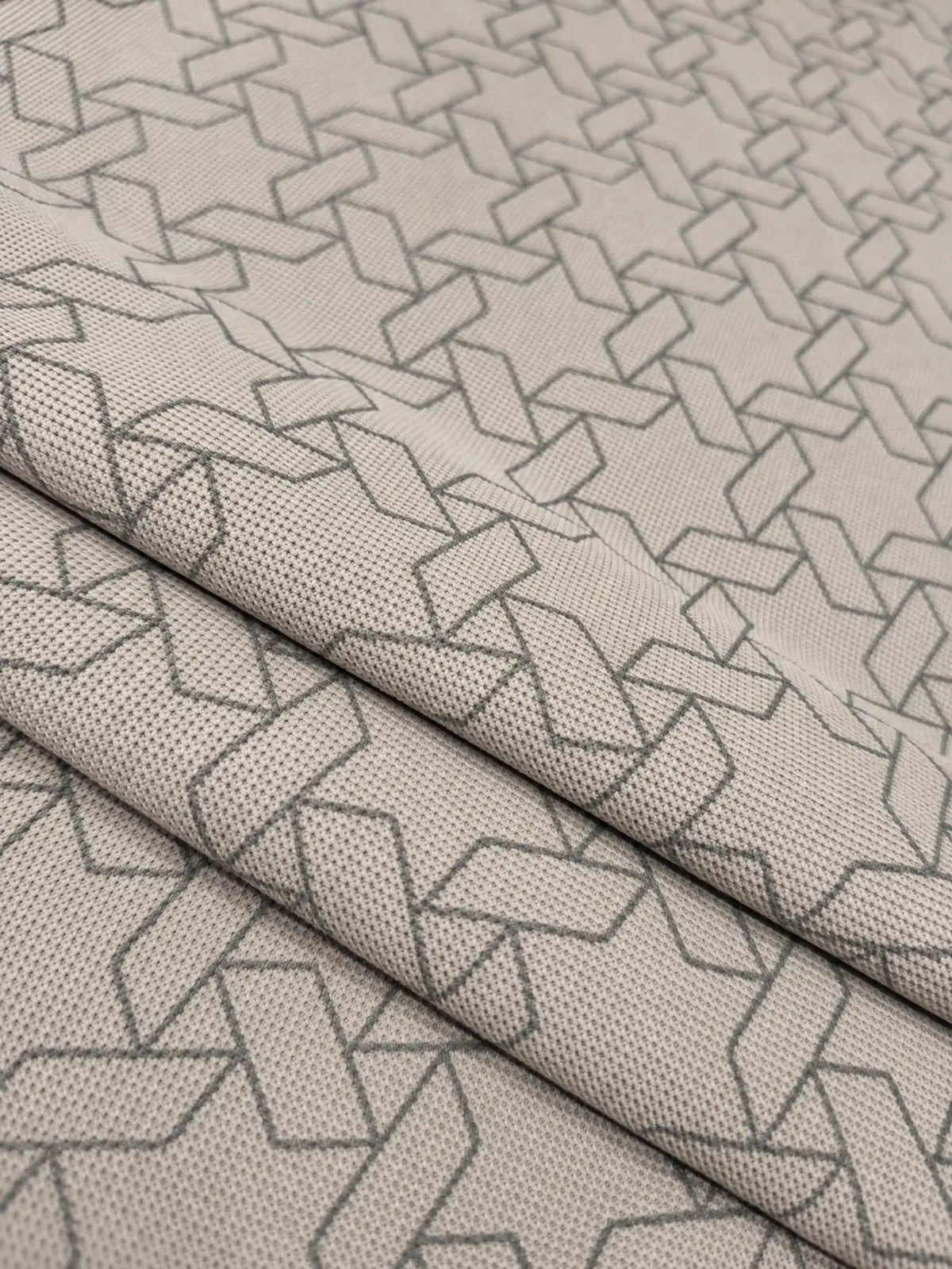 grey geometric print polo t-shirt fabric closeup