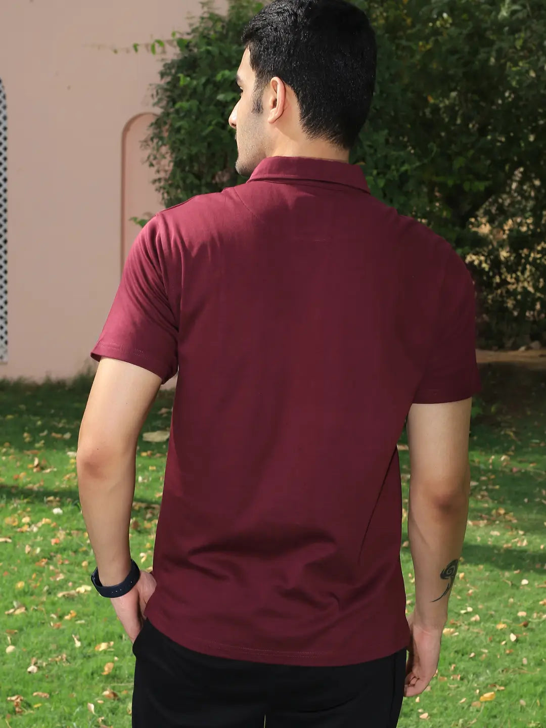 Man wearing a maroon cotton polo t shirt