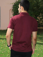 Man wearing a maroon cotton polo t shirt