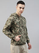 Person wearing a camouflage army print hoodie