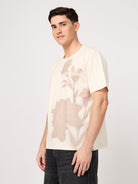 man wearing beige printed t shirt