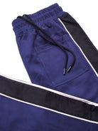 Navy blue and black track pants with white side stripes
