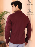 Man wearing a maroon cotton shirt