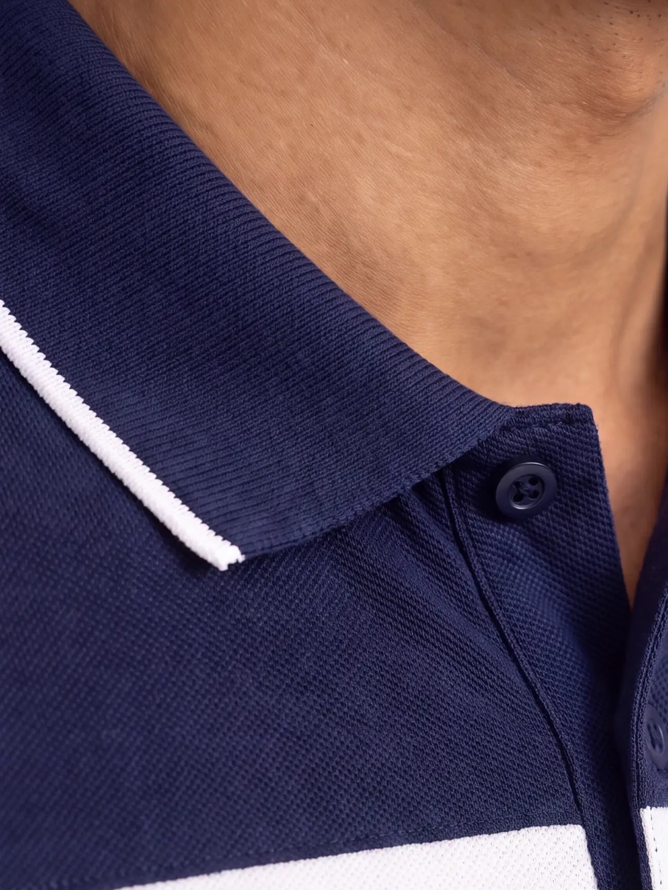 Close-up of a navy blue polo shirt