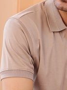 Close-up of a beige polo shirt