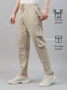 Beige cargo pants with side and cargo pockets on a gray background
