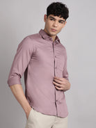 Man wearing a solid button-up shirt