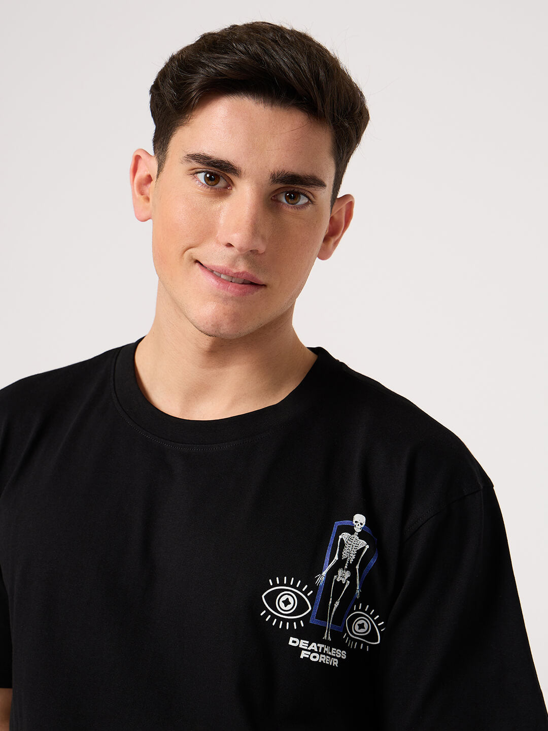 man wearing a black round neck back printed t shirts