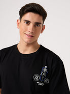 man wearing a black round neck back printed t shirts