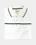 A folded white polo shirt with black trim