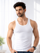 A man wearing a white tank top