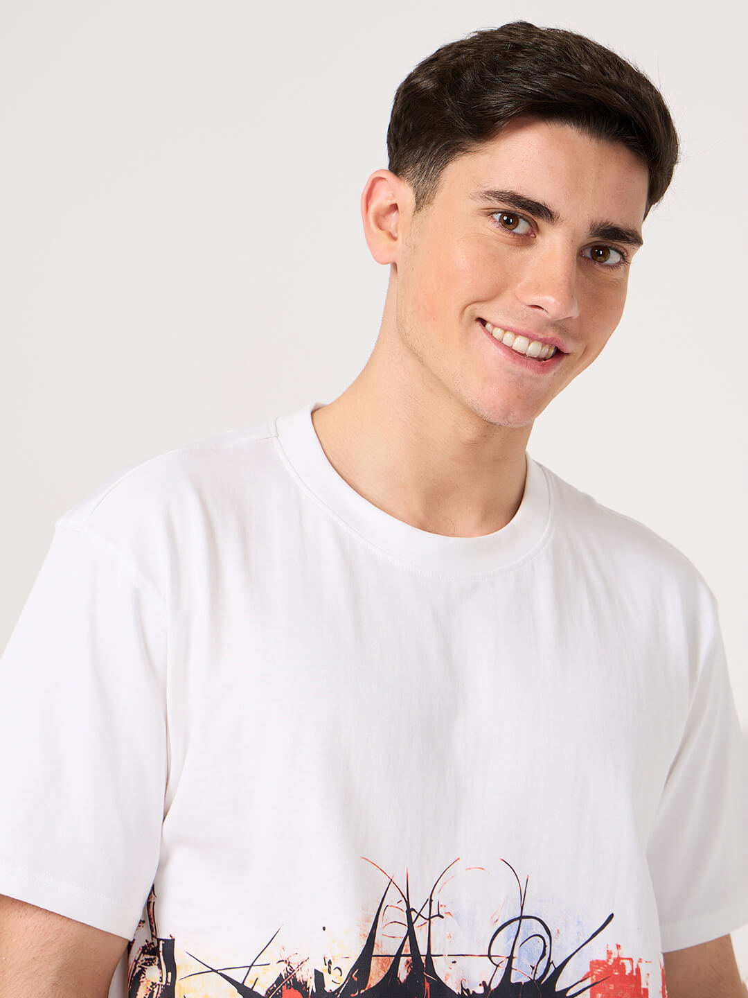 man wearing a white printed t shirt by vogh